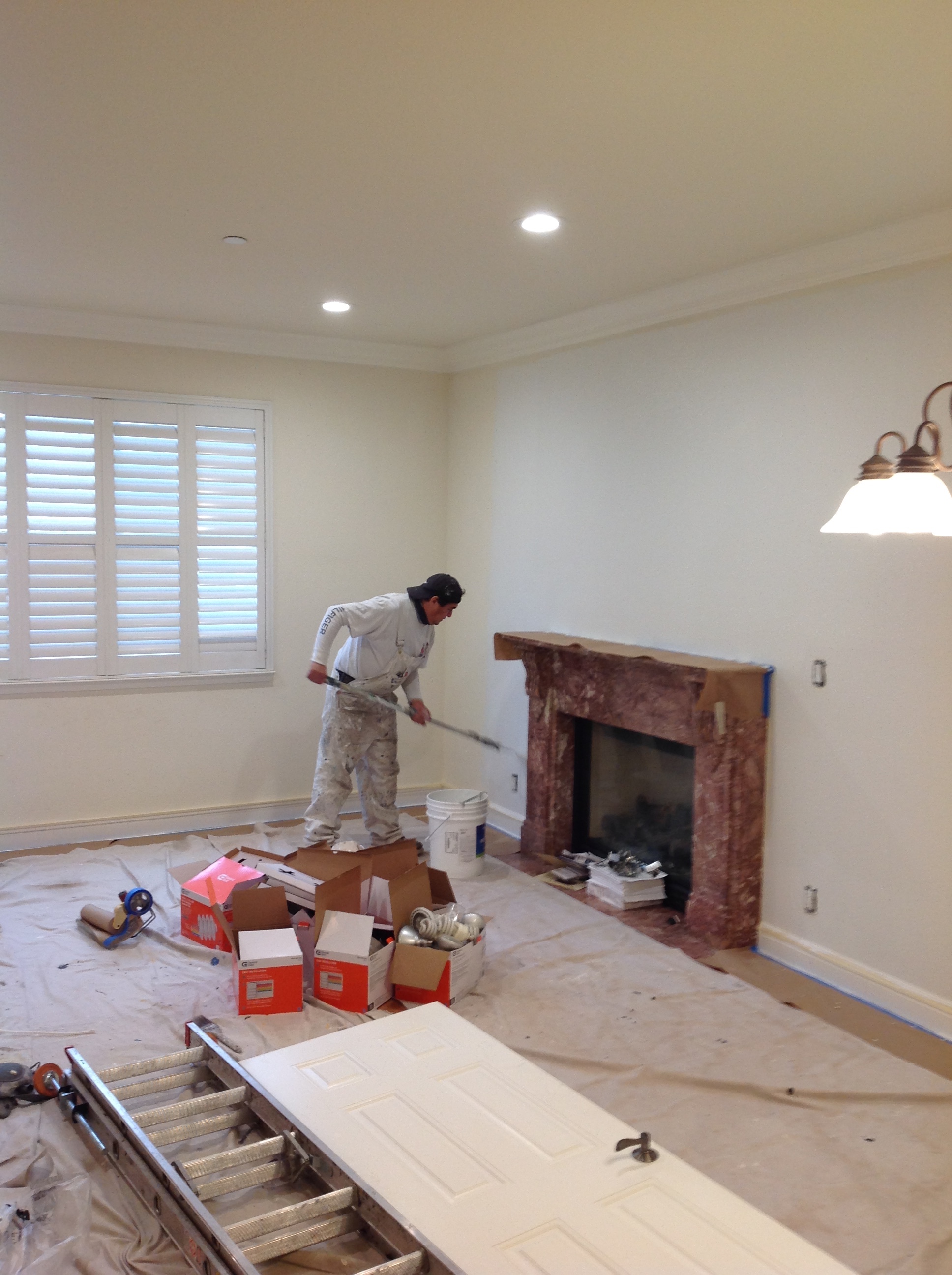 interior painting of residential being done by a done